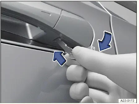 Volkswagen ID.4 - Fig. 1 Driver's door handle: prying off the cap.